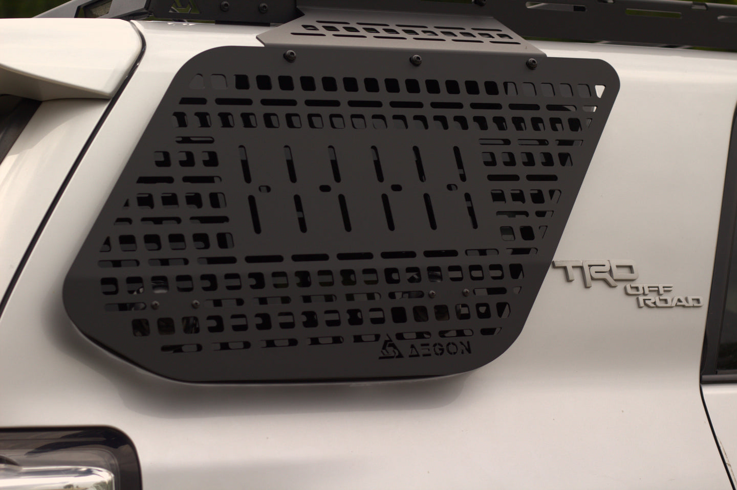 Side view of the 4Runner rear window Molle panel showing the no-drill installation hardware included.