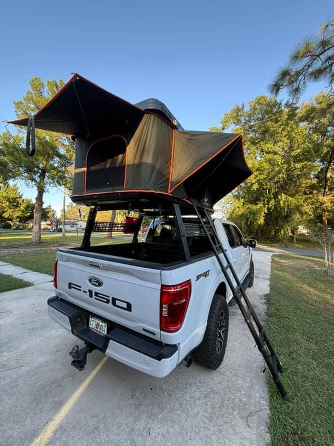 Low profile bed rack adjustment showing 14 inch height for reduced wind resistance.
