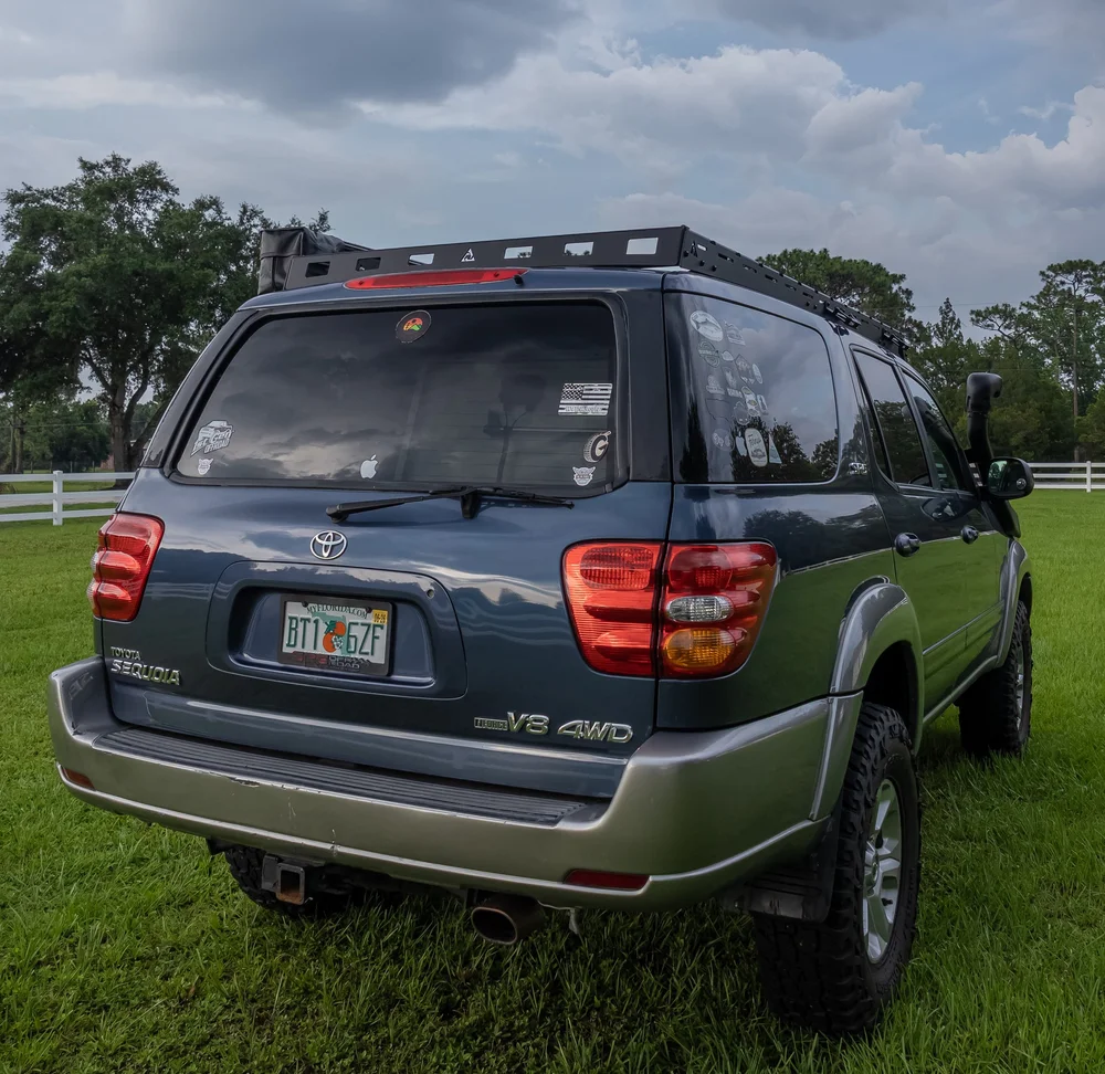 Precision CNC laser-cut steel rear deflector for heavy-duty roof rack integration and durability.