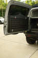 Black powder-coated aluminum Molle panel table for FJ Cruiser supporting up to 120 lbs static load for camping gear.
