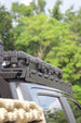 Lightweight Ford F-150 aluminum roof rack with a 900 lbs static load capacity, perfect for camping gear and rooftop tents.