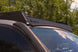 Sleek low-profile aluminum roof rack for Lexus GX 470 including wind deflectors to reduce noise and wind resistance.