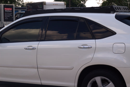 Sleek low-profile aluminum roof rack for Lexus RX 350 with wind deflectors to reduce noise and maintain fuel efficiency.