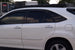 Sleek low-profile aluminum roof rack for Lexus RX 350 with wind deflectors to reduce noise and maintain fuel efficiency.