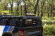 Side accessory slots for secure mounting of shovels and hi-lift jacks on off-road bed rack.