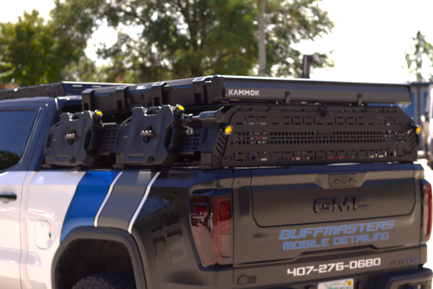 Multiple tie-down points on aluminum bed rack to keep overland gear organized and secure.