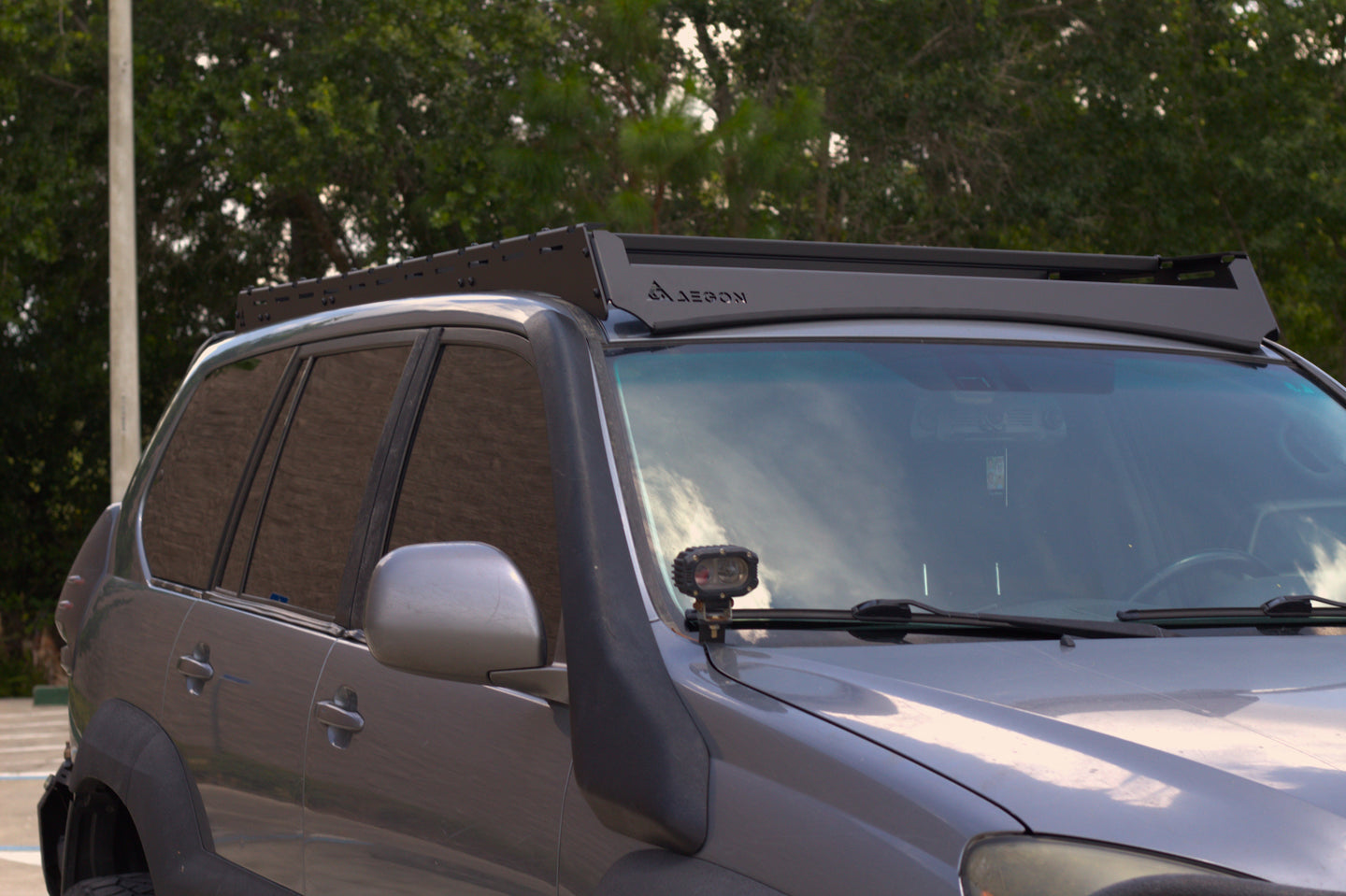 Bolt-on Lexus GX 470 roof rack requiring no drilling, featuring precision CNC laser-cut aluminum side rails.
