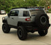 Premium aluminum overland roof rack for hauling camping equipment and heavy gear on a Toyota FJ Cruiser.