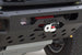 Close-up of a black metal front bumper with a winch mounted on it, featuring the AEGON brand name on the bumper and a winch housing with red and white components.