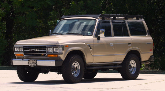 AEGON full-length aluminum roof rack installed on a vintage Toyota Land Cruiser FJ60.