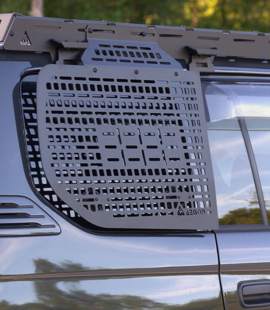 Interior window Molle panel installed in a Toyota Land Cruiser Prado 90 Series for modular gear storage.