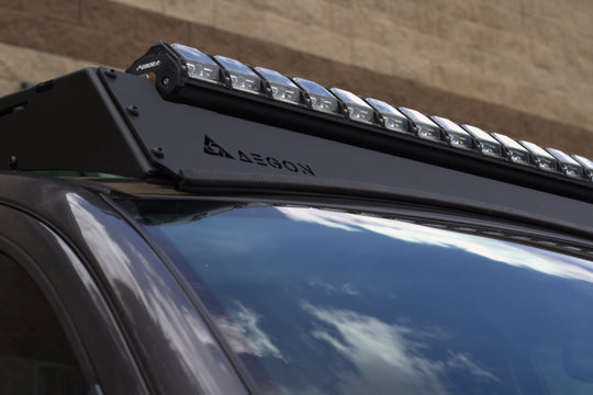 Heavy-duty black steel roof rack designed for Toyota Tundra CrewMax models from 2007 to 2021.